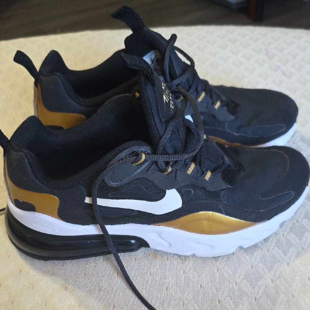 Nike Black and Gold Sneakers with Modern Design